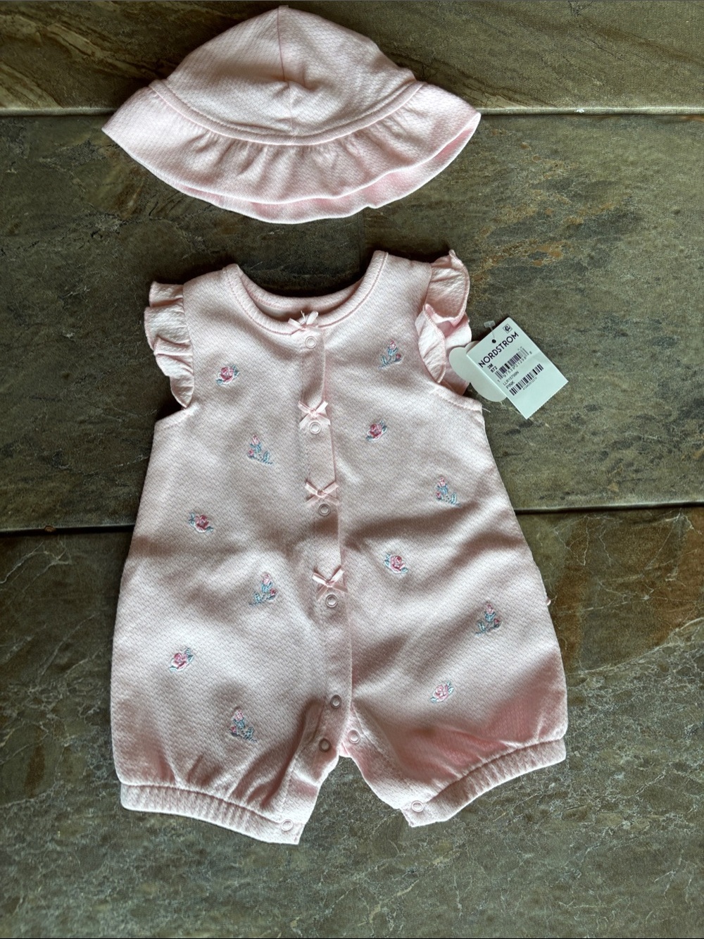 Little Me Light Pink ruffled romper with matching hat.